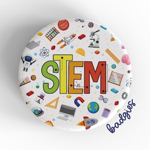 May include: A white button with a colorful STEM design. The button is decorated with various science and technology icons, including a rocket, a microscope, a computer, and a globe. The word "STEM" is written in large, colorful letters in the center of the button. The text "badges" is written in blue at the bottom of the button.