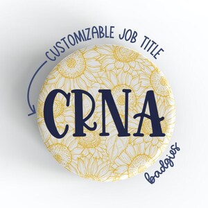 May include: A white button with a sunflower pattern and the text "CUSTOMIZABLE JOB TITLE CRNA badgix" in navy blue.
