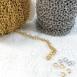 May include: Two spools of chain, one gold and one silver, with a short length of gold chain and several jump rings.