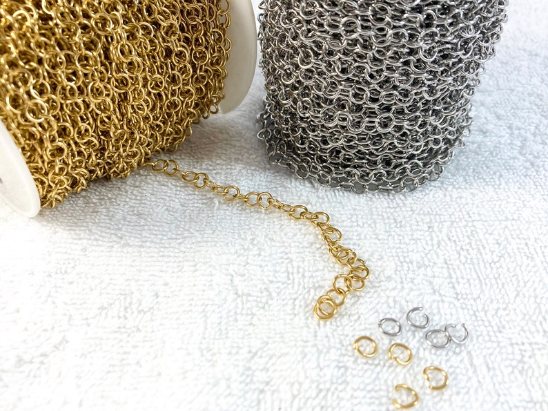 May include: Two spools of chain, one gold and one silver, with a short length of gold chain and several jump rings.