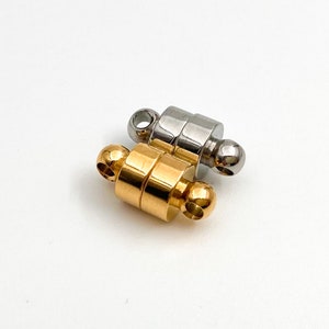 May include: Two magnetic clasps for jewelry making. One is gold and the other is silver.