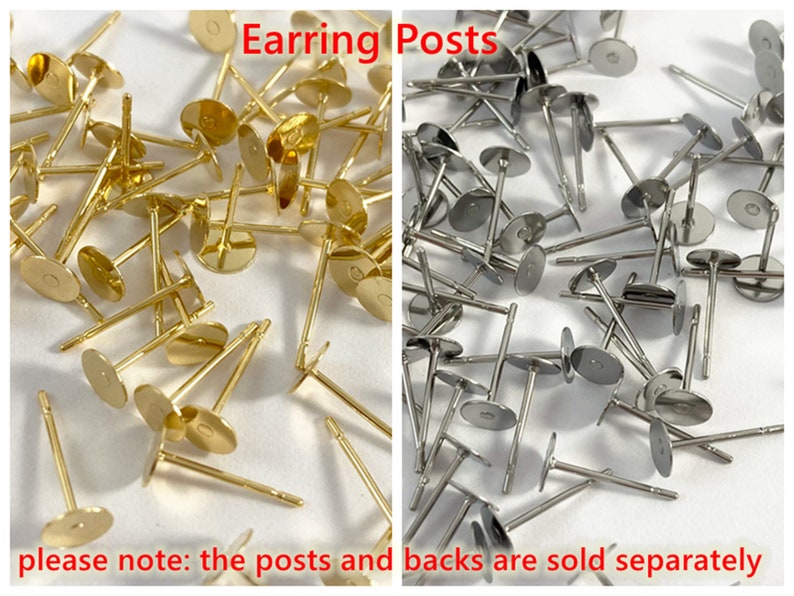 May include: A close-up image of a large quantity of gold and silver earring posts. The posts are made of metal and have a flat, round base. The text "Earring Posts" is written in red letters at the top of the image. The text "please note: the posts and backs are sold separately" is written in red letters at the bottom of the image.