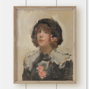 May include: A framed oil painting of a woman wearing a black hat with pink flowers. She is wearing a white collar and a black jacket. The painting is signed "IRENE" in the bottom right corner.
