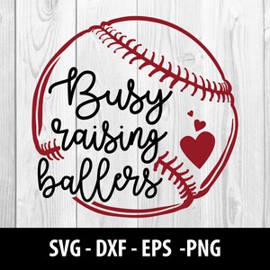 May include: Red baseball with white stitching and the text "Busy raising ballers" in black. There are three small red hearts on the baseball.