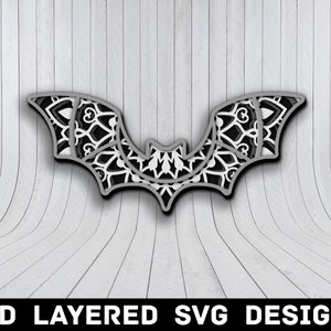 Peut inclure: Un design SVG 3D en couches d'une chauve-souris noire et blanche avec un motif de mandala. La chauve-souris est dans un style en couches, avec les ailes et le corps qui se chevauchent.