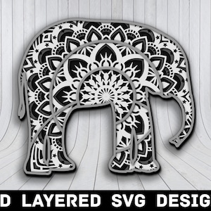 Puede incluir: Un diseño en capas en blanco y negro de un elefante hecho de patrones de mandala. El elefante está de pie sobre un fondo de madera blanca.