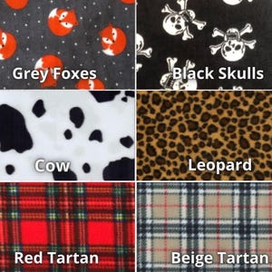K&ouml;nnte beinhalten: Eine Collage aus sechs verschiedenen Stoffmustern, jedes mit einem einzigartigen Muster. Die Muster sind mit folgenden Namen beschriftet: Graue F&uuml;chse, Schwarze Sch&auml;del, Kuh, Leopard, Roter Tartan und Beiger Tartan.