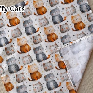 May include: White fabric with a repeating pattern of cartoon cats in orange, gray, and white. The cats are in various poses, with small dots scattered around them. The words "Fluffy Cats" are in the upper left corner.