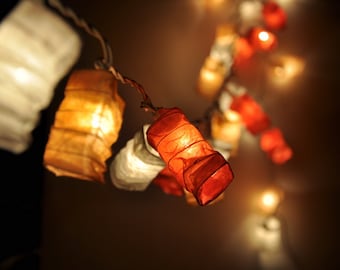 Luces de hadas de papel naranja con forma de estrella: decoración navideña para dormitorio
