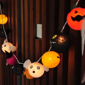 Halloween-lichtslingers: pompoen, heks, spookslinger