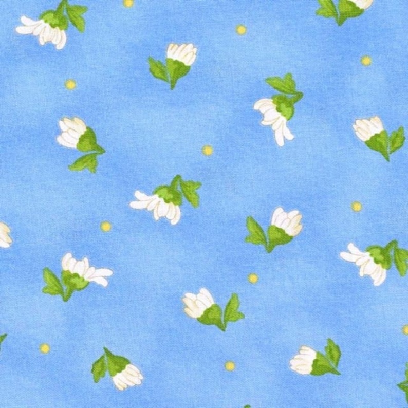 May include: A blue fabric with a repeating pattern of white flowers and yellow dots.