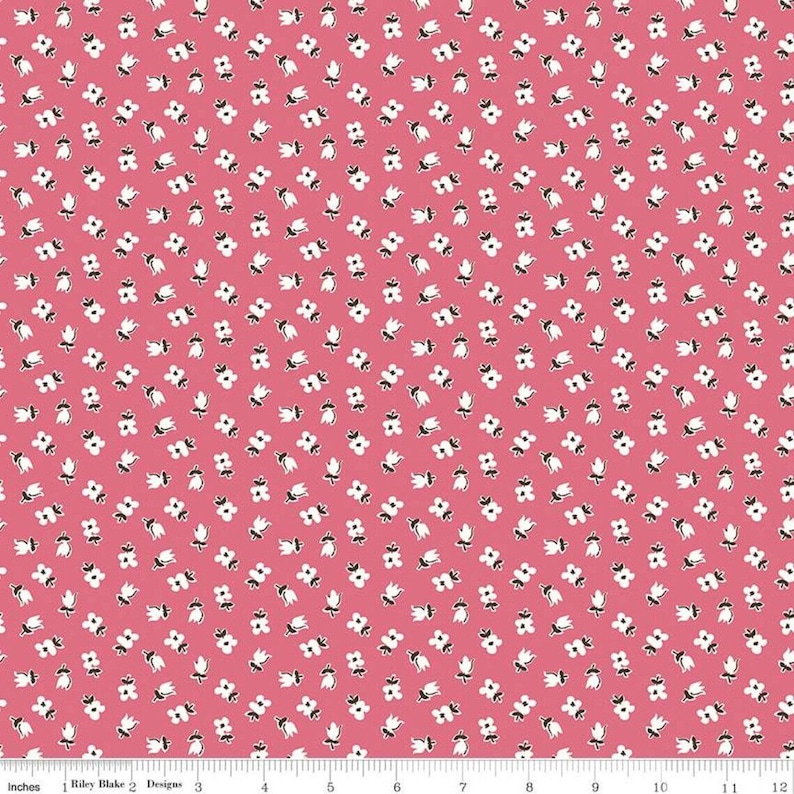 May include: Pink fabric with a white floral pattern. The flowers are small and have a simple design. The fabric is ideal for quilting, crafts, and other sewing projects.