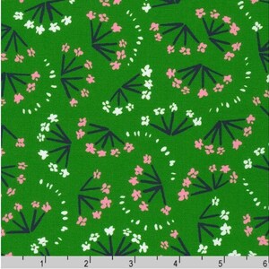 May include: A green fabric with a repeating pattern of white and pink stylized flowers with dark blue stems.