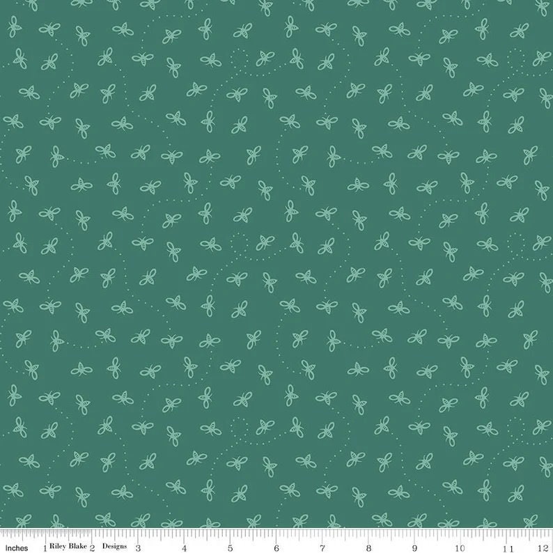 May include: Teal fabric with a repeating pattern of white bees. The bees are outlined in white and have a simple design.
