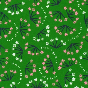 May include: A green fabric with a repeating pattern of white and pink flowers with dark blue stems. The flowers are arranged in clusters and are surrounded by small white dots.