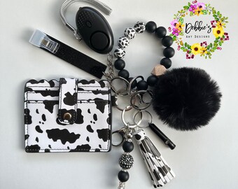 Cow print, Safety keychains, defense, beaded wristlet, accessories, wallet, led light alarm, whistle, card grabber and more, black and white