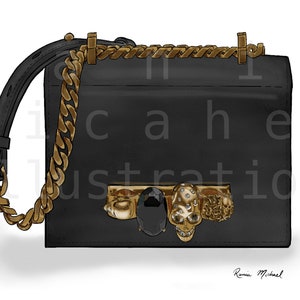 May include: Black handbag with gold chain strap and accents. The bag features a gold chain trim, a black gemstone, and skull embellishments. The bag has a black leather strap and a gold chain strap.
