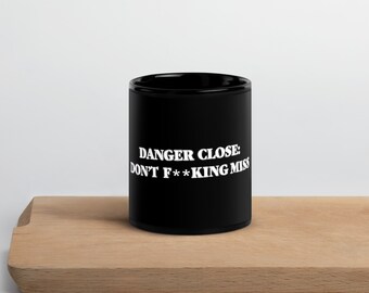 Danger Close warning on our black Glossy Mug