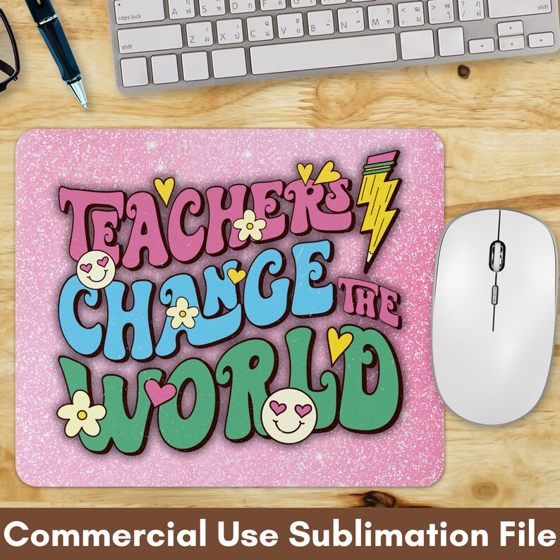 May include: A pink mouse pad with a glitter background and the text "Teachers Change the World" in colorful, retro-style lettering. The text is decorated with hearts, flowers, and smiley faces.