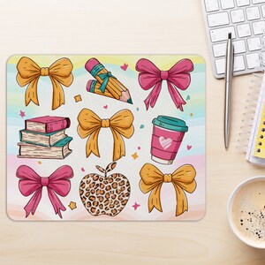 May include: A colorful mousepad with a variety of illustrations, including bows, pencils, books, a coffee cup, and a leopard print apple. The background is a light blue and pink watercolor design.