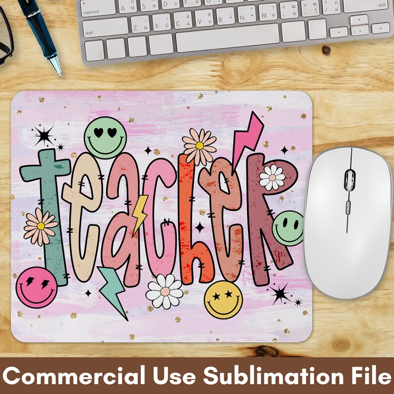 May include: A pink and white mouse pad with the word "teacher" written in colorful, stylized letters. The letters are decorated with flowers, stars, and smiley faces. The mouse pad is designed for sublimation printing.