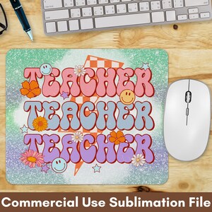 May include: A sublimation design featuring the word "TEACHER" repeated three times in a retro, groovy font. The text is in pink, blue, and purple with a checkered background and a lightning bolt. The design is surrounded by flowers and stars.