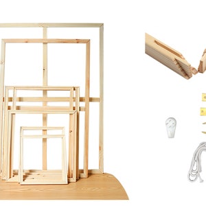 May include: Set of five wooden canvas frames in various sizes, with a white background. The frames are made of natural wood and have a smooth finish. The set includes hardware for hanging, such as D-rings, screws, and a sawtooth hanger.