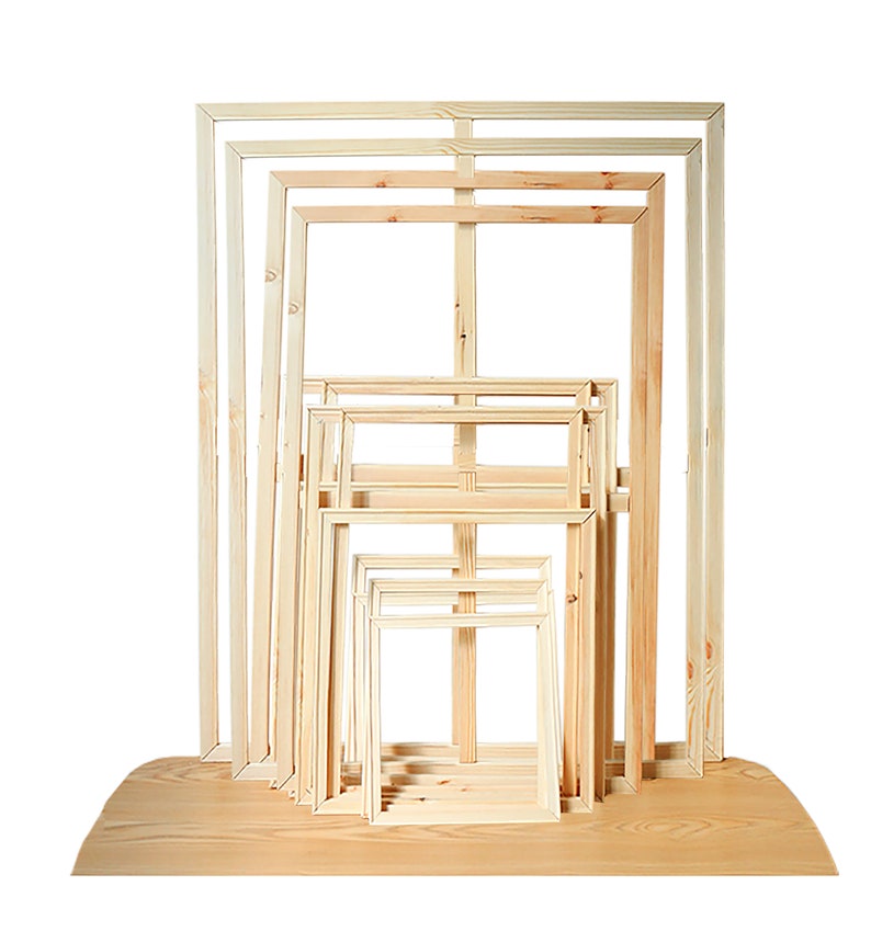 May include: A set of seven wooden canvas frames in various sizes, stacked and arranged in descending order from largest to smallest. The frames are made of natural, unpainted wood.