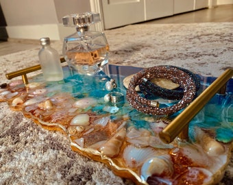 Resin tray  with seashell embelishments .