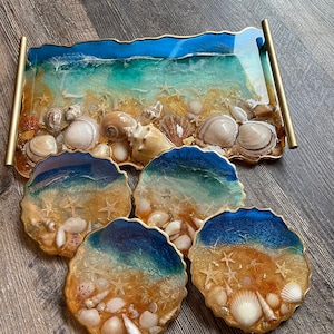 Resin ocean coaters   (25) dollars per coaster )with seashell embelishments .