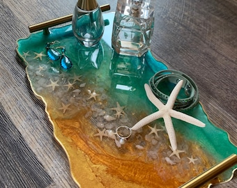 love the tropical ocean you will love this  Elegant Resin ocean tray with sea star /gold flakes  and gold handles . Dimensions are 14 by 8 .