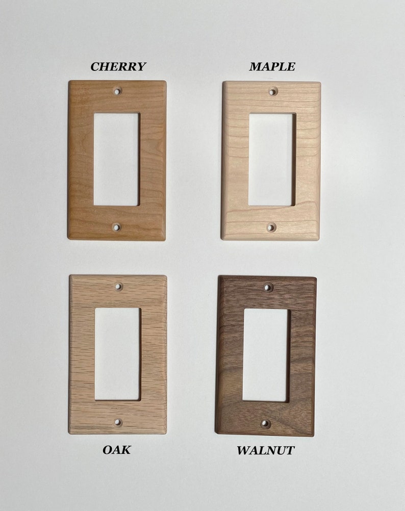 May include: Four wooden light switch plates in different wood finishes: cherry, maple, oak, and walnut.