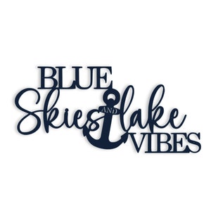 May include: Blue metal sign with the text "Blue Skies and Lake Vibes" and an anchor in the middle.