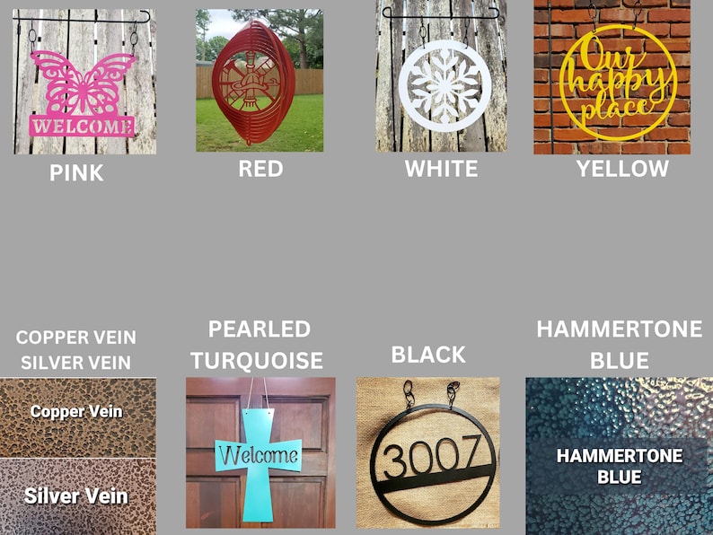 May include: A collection of decorative metal signs in various colors and designs. Includes a pink butterfly with "WELCOME", a red wind spinner, a white snowflake, and a yellow "Our happy place" sign. Also shown are signs in copper, silver, turquoise, black, and blue.