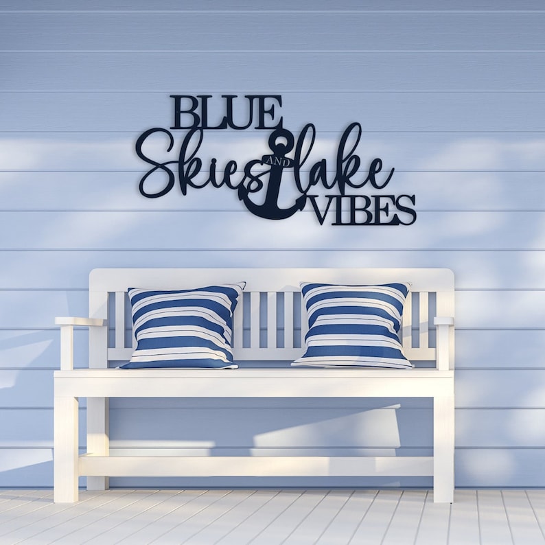 A metal sign for your lake house decor that says Blue skies and lake vibes.