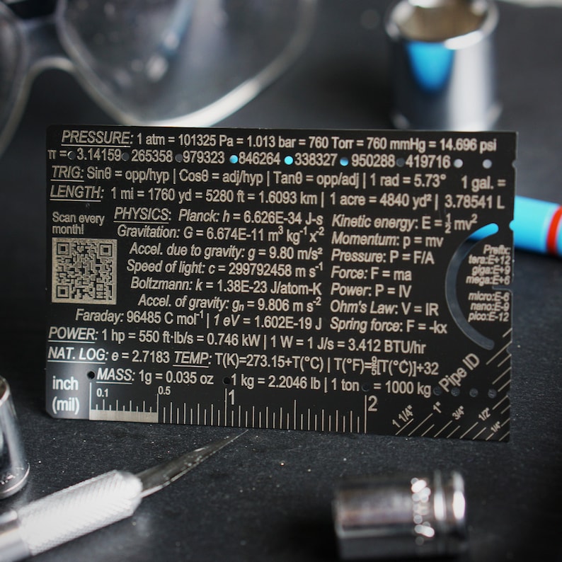 May include: A black metal ruler with a variety of measurements and conversions for pressure, length, physics, power, temperature, and mass. The ruler also includes a pipe ID chart and a QR code.