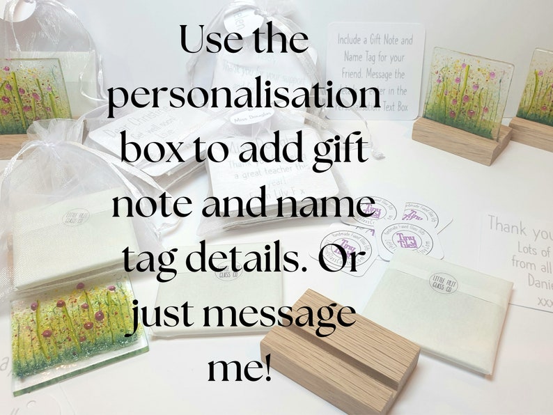 May include: A collection of small glass art pieces with floral designs, displayed on wooden stands. The image includes instructions for adding a personalized gift note and name tag. The text reads "Use the personalization box to add gift note and name tag details. Or just message me!"