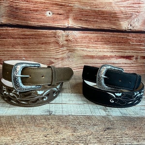 May include: Two leather belts with silver buckles and embroidered floral designs. One belt is brown and the other is black.