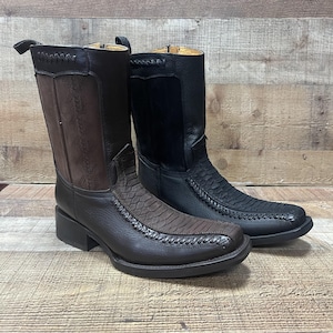 May include: Two pairs of brown leather cowboy boots with a snakeskin pattern. One pair is brown and the other is black.