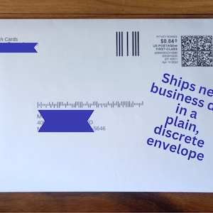 May include: White envelope with blue markings and text that reads "Ships next business day in a plain, discrete envelope".