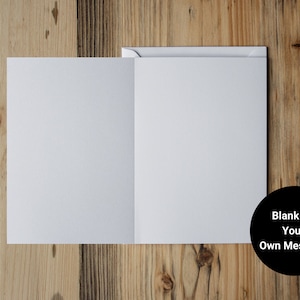 May include: A blank white card with a black circle that says "Blank For Your Own Message!" The card is on a wooden surface.