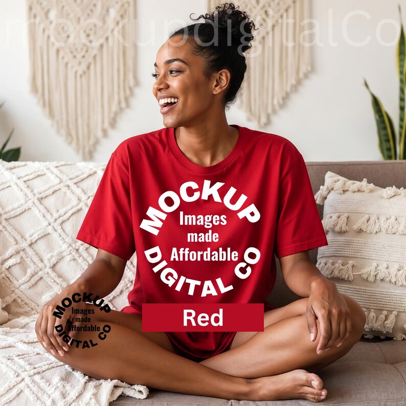 May include: A red t-shirt with the text "MOCKUP Images made Affordable DIGITAL Co" in a white circular design. The word "Red" is displayed in a red rectangle. The person is sitting on a couch.