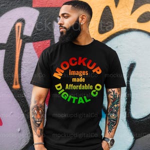May include: A black t-shirt with a colourful graphic design that says "MOCKUP Images made Affordable DIGITAL CO".