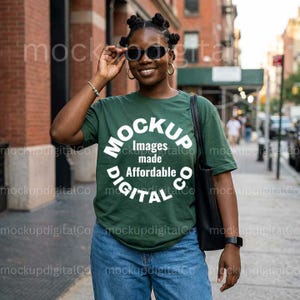 May include: A person wearing a dark green t-shirt with the text "MOCKUP Images made Affordable DIGITAL CO" in a white circular design. The person is wearing blue jeans and sunglasses.