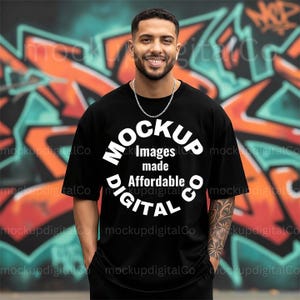May include: Black t-shirt with the text "MOCKUP Images made Affordable DIGITAL" in a white circular design. The background features graffiti art in orange, teal, and black.