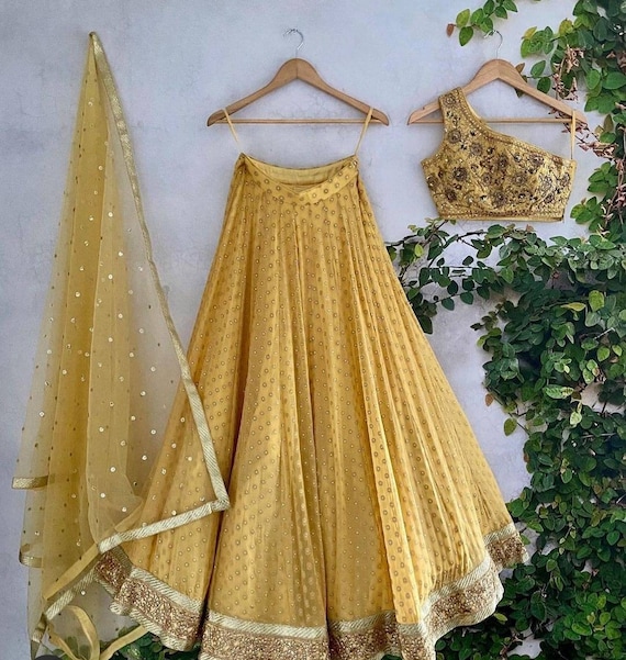 Buy Yellow Korean Crepe One Shoulder Embroidered Off Blouse And Lehenga Set  For Women by Izzumi Mehta Online at Aza Fashions.