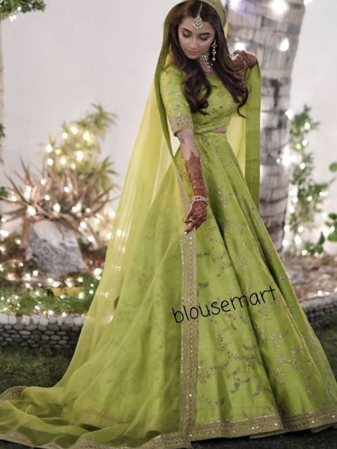 naira in green lehenga