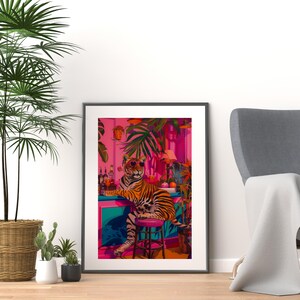 May include: A framed art print depicting a tiger in sunglasses at a bar, surrounded by tropical plants and drinks. The artwork uses a vivid colour scheme of pink, teal, and orange, creating a whimsical, tropical atmosphere.