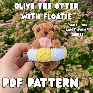 May include: A crocheted brown otter toy wearing a yellow and white floatie, with the text "OLIVE THE OTTER WITH FLOATIE" and "WAIT... YOU CAN'T SWIM? SERIES" above it. The text "PDF PATTERN" is at the bottom.