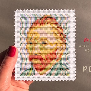 May include: A mini cross stitch pattern of a portrait of Vincent van Gogh, featuring a close-up of his face and beard. The pattern is 40 stitches wide by 50 stitches high. The pattern is available as a PDF download.